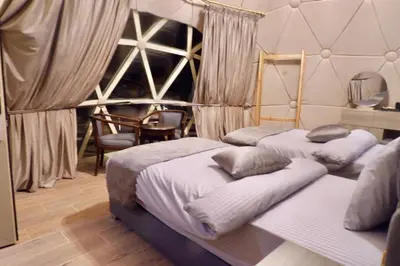 two beds in a room with atainedasteryasteryasteryasteryasteryasteryasteryastery at Beyond Wadi Rum Camp in Wadi Rum