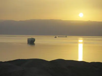 two boats in the water at sunset at Red Sea Dive Center in Aqaba