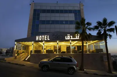 a car parked in front of a hotel at 360 Hotel By FHM in Amman