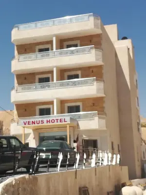 a building with a sign that reads venus hotel at Venus Hotel in Wadi Musa