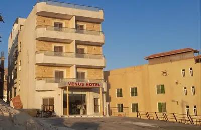 a building with a sign that reads views hotel at Venus Hotel in Wadi Musa