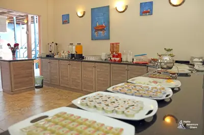 a kitchen with four plates of pastries on a counter at Aqaba Adventure Divers Resort & Dive Center in Aqaba
