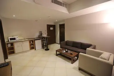 a living room with a couch and a table at Jabal Amman Hotel (Heritage House) in Amman