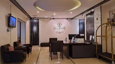 a lobby with a desk and chairs in a room at Jabal Amman Hotel (Heritage House) in Amman