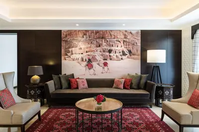 a living room with a couch and a table at Al Manara, a Luxury Collection Hotel, Aqaba in Aqaba
