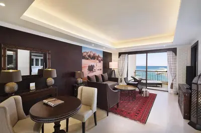 a living room with a couch and a table at Al Manara, a Luxury Collection Hotel, Aqaba in Aqaba