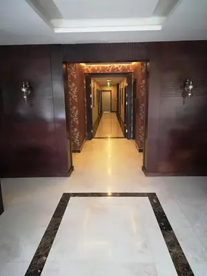 a hallway of a building with a hallway leading to a hallway at Shams Alweibdeh Hotel Apartments in Amman