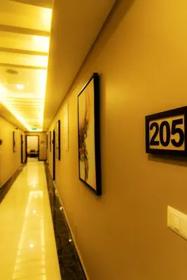 a hallway in a hospital with a sign on the wall at Shams Alweibdeh Hotel Apartments in Amman