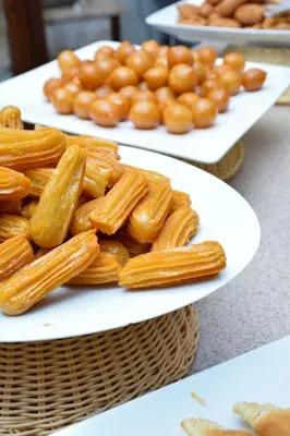 two white plates of pasta on a table at The Seventh Star Hotel Suites in Amman