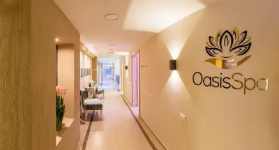 a corridor of a hospital with a sign on the wall at Amman International Hotel in Amman
