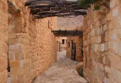 an alley way in an old stone building at Hayat Zaman Hotel And Resort Petra in Wadi Musa