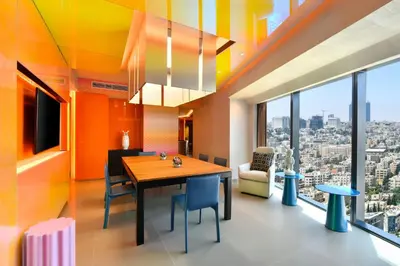 a dining room with a view of the city at W Amman Hotel in Amman