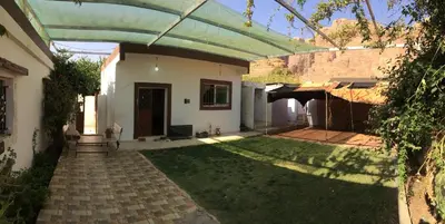 a backyard of a house with a patio at Climbers House in Wadi Rum in Wadi Rum