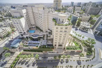an aerial view of a building in a city at Grand Hyatt Amman in Amman