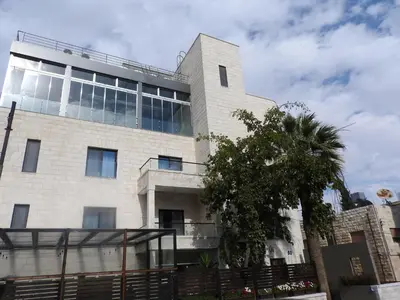 a building with a lot of windows on it at La Locanda Boutique Hotel in Amman