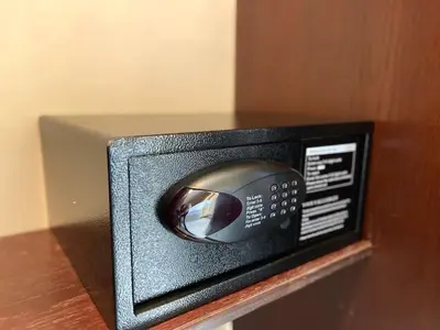a microwave sitting on top of a wooden table at Dweik Hotel 2 in Aqaba