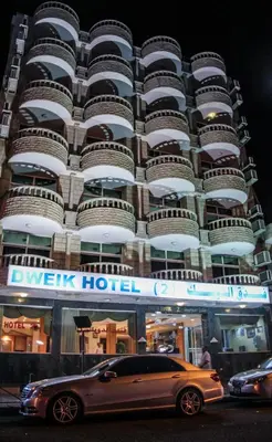 a car parked in front of a building at Dweik Hotel 2 in Aqaba