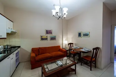 a living room with a couch and a table at Comfort Hotel Suites in Amman