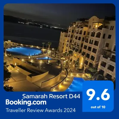 a picture of a city at night with lights at Apartment Samarah Resort Sea & Pool view D in Sowayma