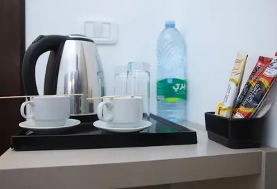 two coffee cups on a tray on a counter at Spark Plaza Hotel in Amman