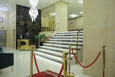 a set of stairs with red ropes in a lobby at Spark Plaza Hotel in Amman
