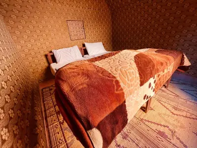 a bedroom with a bed in a room at Bedouin Lifestyle Camp in Wadi Rum