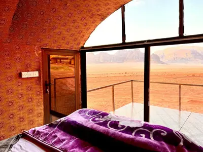a room with a window with a view of the desert at Bedouin Lifestyle Camp in Wadi Rum