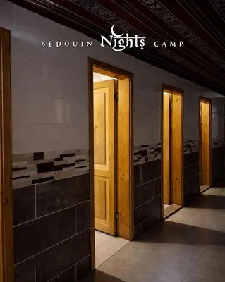 a row of doors on the side of a building at Bedouin Nights Camp in Wadi Rum