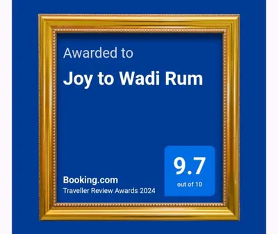 a picture frame with a sign that says joy to waldo run at Joy to Wadi Rum in Wadi Rum
