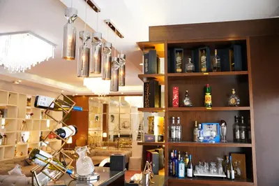 a room with a liquor store with bottles on shelves at Lijam Hotel in Amman