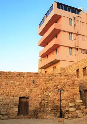 a building sitting on top of a stone wall at Orient Gate in Wadi Musa