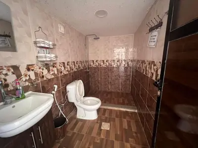 a bathroom with a toilet and a sink at Jamal Rum desert in Wadi Rum