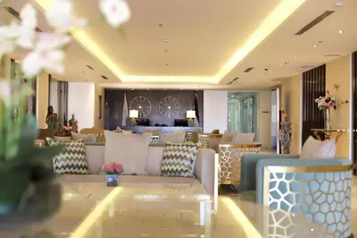 a living room with couches and a table at The SanRock Hotel in Amman