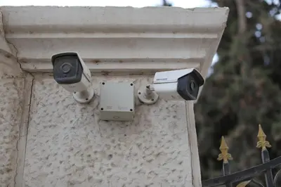 two security cameras on the side of a building at Western Gate Residence 1 - Amman, Jordan in Amman