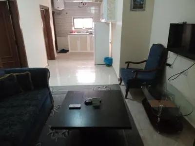 a living room with a couch and a coffee table at Petra Visitors Hotel in Wadi Musa