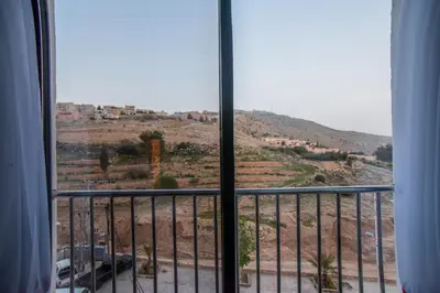 a view from a balcony with a view of a hill at Petra Boutique Hotel in Wadi Musa