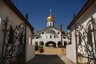 an entrance to a church with a gold dome at Russian Pilgrim Residence in Sowayma