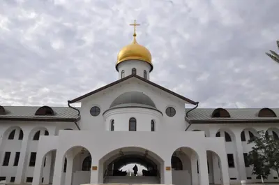 a church with a gold dome on top of it at Russian Pilgrim Residence in Sowayma