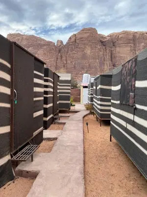 a row of portable toilets in the desert at Bedouin Village Hostel in Wadi Rum