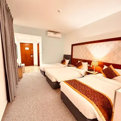 a hotel room with two beds in a room at Aquavista Hotel & Suites in Aqaba