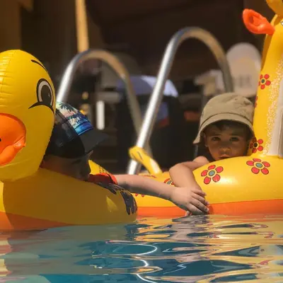 two young boys playing on an inflatable at Orient Villa-Dead Sea in Sowayma