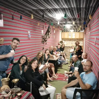 a group of people sitting in a room at Majido Hotel in Wadi Musa