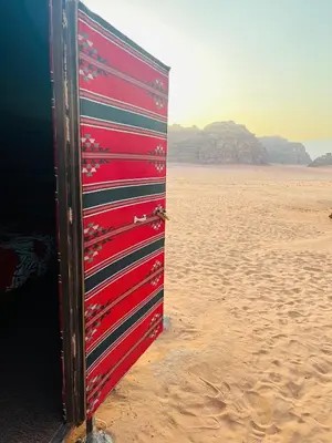 a wooden object sitting on the sand on the beach at Bedouin host camp& with tour in Wadi Rum