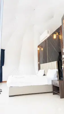 a bedroom with a bed and a mirror at Rum Paradise luxury camp& BUBBLE in Wadi Rum