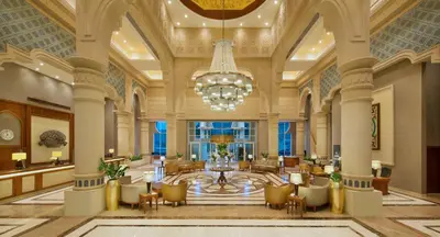 a lobby of a hotel with a chandelier at Crowne Plaza Jordan Dead Sea Resort & Spa by IHG in Sowayma