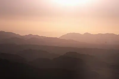 a silhouette of a mountain range at sunset at Magic Wadi Rum in Wadi Rum