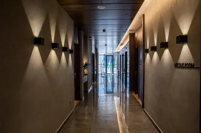 a hallway of a building with wooden ceilings and wooden floors at The Compass Hotel in Amman