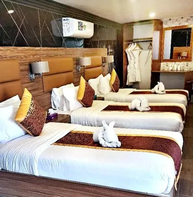 a room with four beds with stuffed animals on them at Seven Wonders Luxury Camp in Wadi Musa