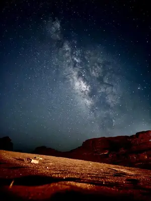 a starry night with the milky way in the sky at Wadi rum Silk Road camp in Wadi Rum