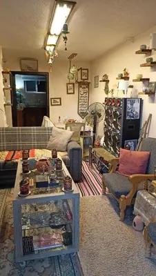 a living room filled with lots of furniture at Petra Heritage House in Wadi Musa